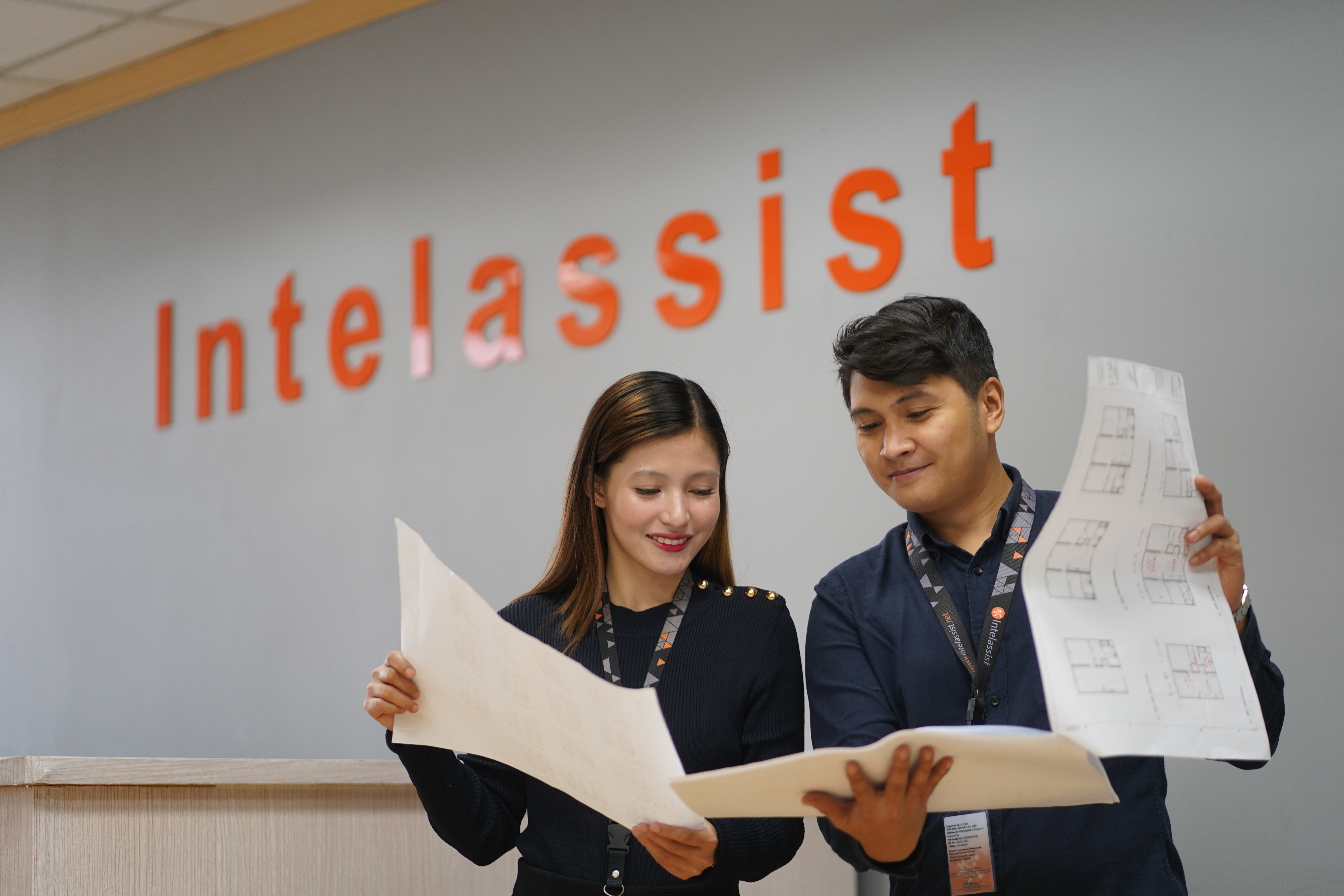 Two Intelassist remote staffing employees